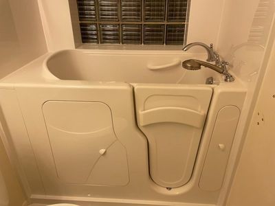 Walk in bathtub with a seat