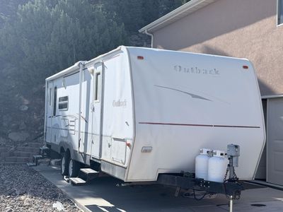 2006 Keystone Outback 27ft Travel Trailer w/ 2 Queen Beds, Camp Kitchen, Slide Out