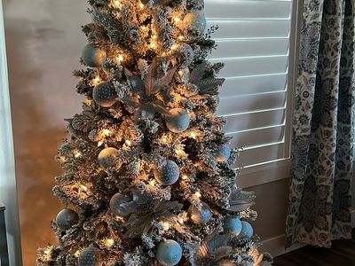 6’ flocked Christmas tree with decorations