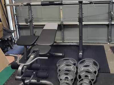 Bench and 255 pounds of weights