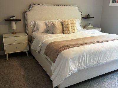 King size upholstered bed with nightstands