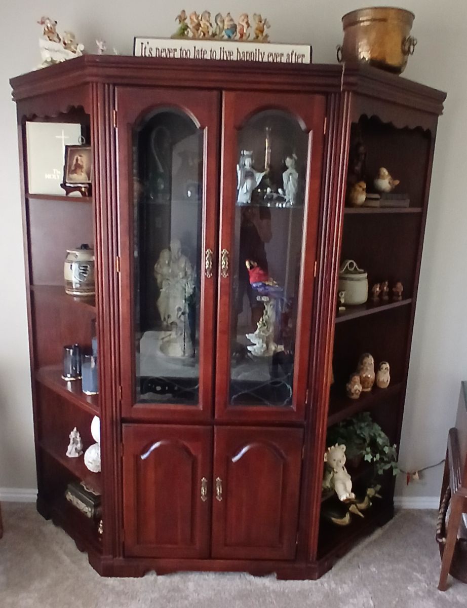 Curio cabinet with side shelves