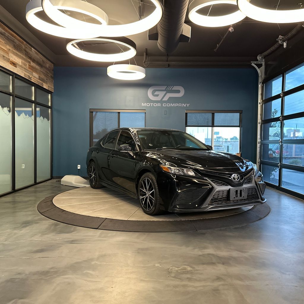 2021 Toyota Camry SE — rebuilt & branded title, 24% below market