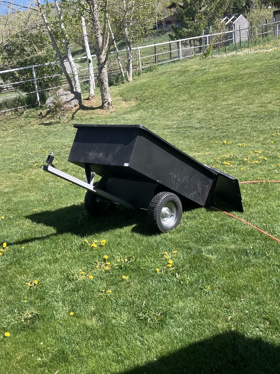 Pull behind yard dump trailer.