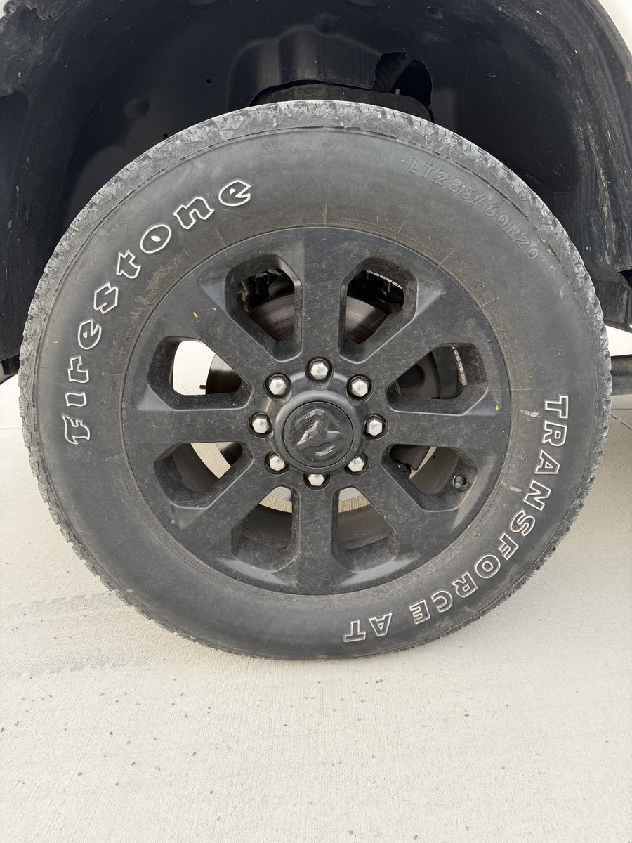 Firestone Transforce AT LT285/60R20 Tires on Black OEM RAM 20" Wheels