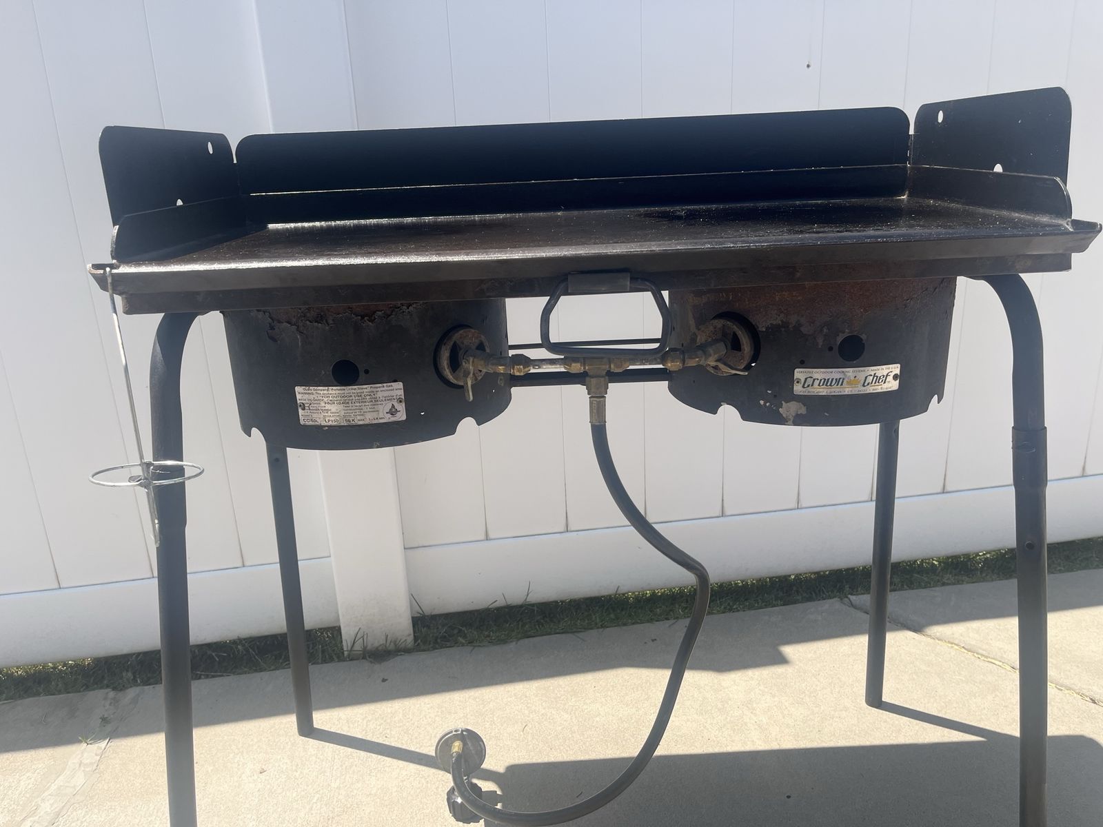 Camp stove with griddle and storage bags