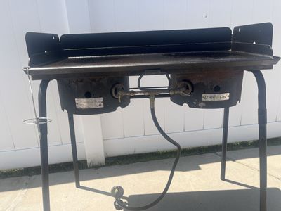 Camp stove with griddle and storage bags