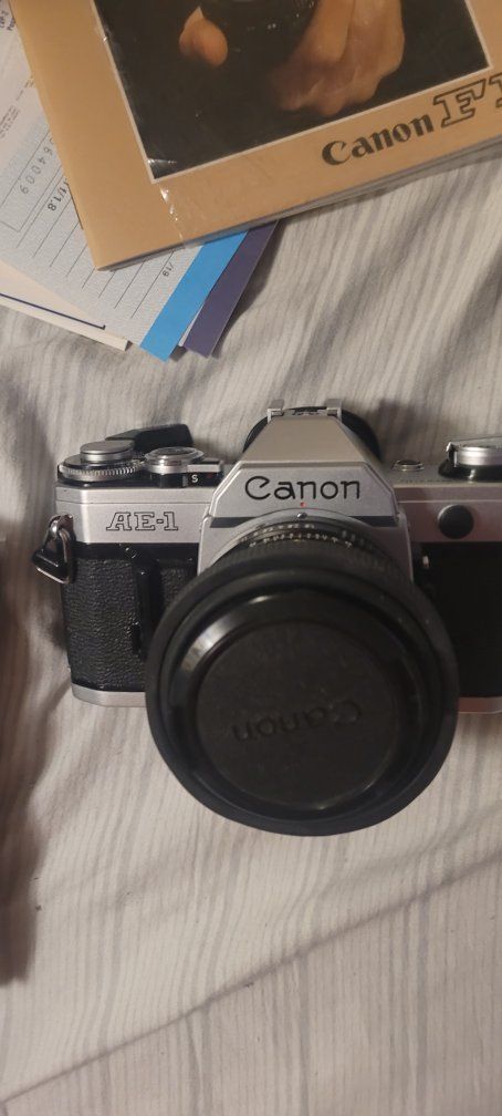 Canon AE-1 Program 35mm SLR Film Camera with Canon 50mm f/1.8 FD Lens and Vivitar Flash.