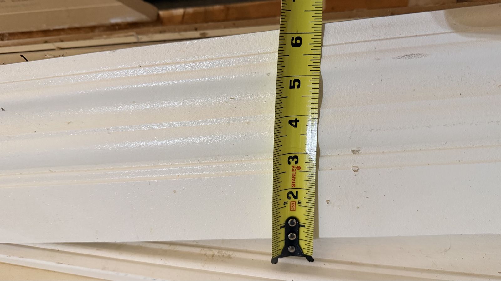 Primed white 6” and 4” baseboards