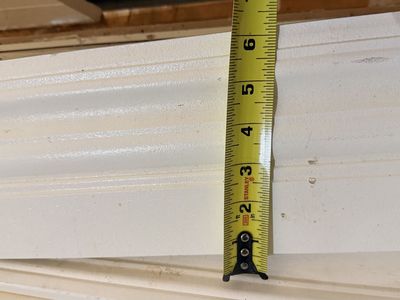 Primed white 6” and 4” baseboards