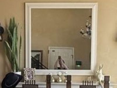 46” by 46” framed mirror with mounting hardware for easy installation
