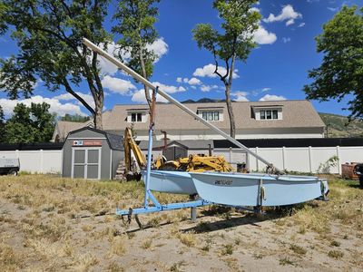 Light Blue Small Sailboat with Trailer - Ready for Water Adventures