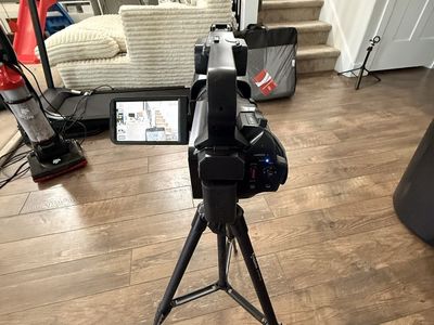 DVC Digital Video Camera on Tripod