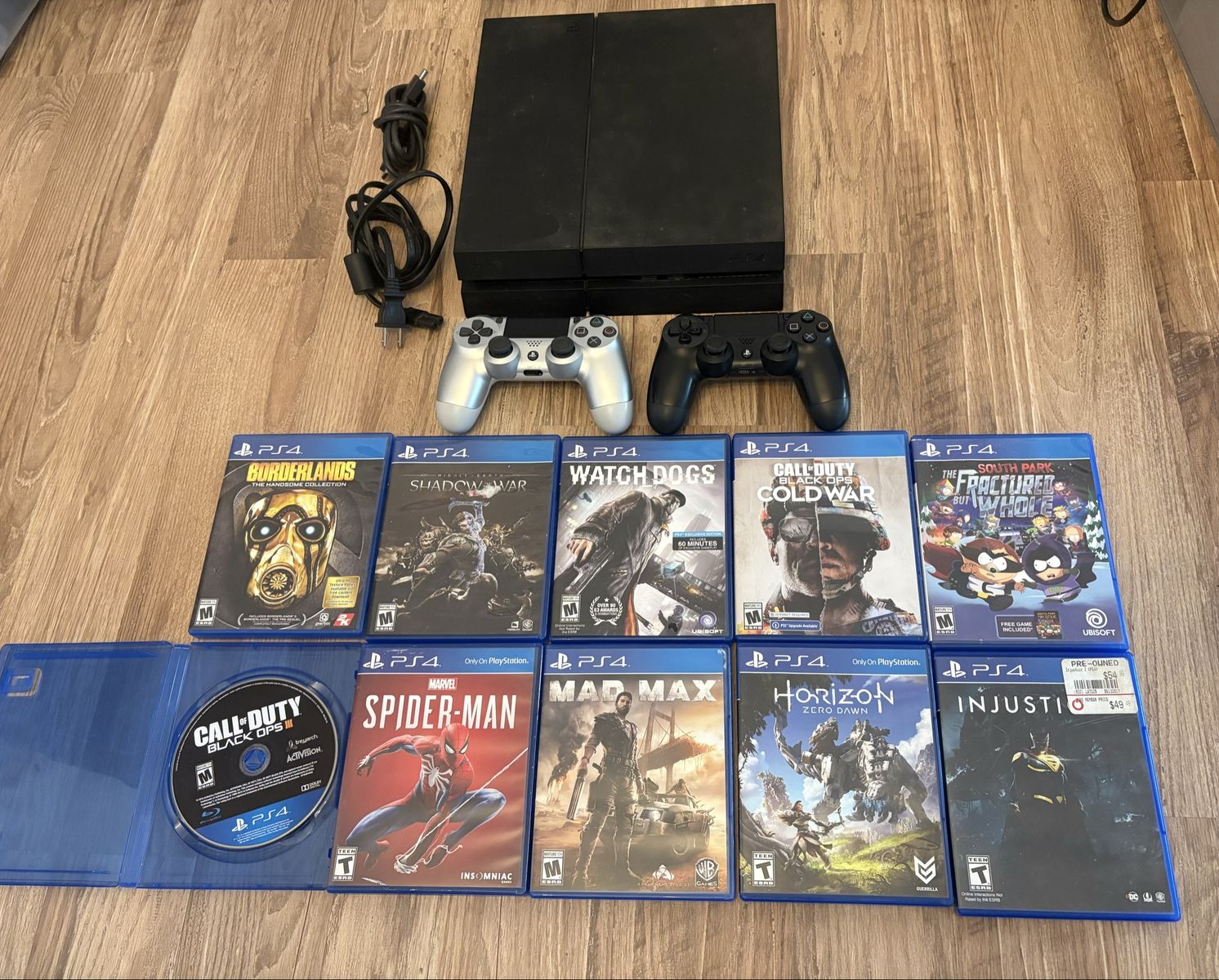 PS4 Original w/ 2 controllers and 10 games