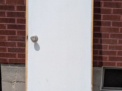 Used White Interior Door 79.5" x 24" with Doorknob and Hooks - Good Condition