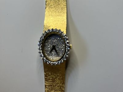 Vintage 18KT (stamped) Yellow Gold watch. Diamond encrusted. Pave face.