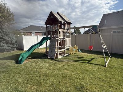 Free KidKraft Cedar Summit Playset with Slide, Swings, Rock Wall - Wooden Outdoor Playset