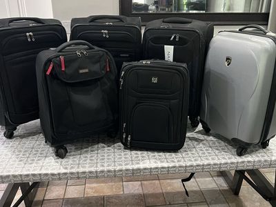 Assorted carry-on luggage (American Tourister, Nautica, Ful & Heys)
