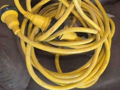 Heavy Duty Yellow Electrical Extension Cord - Used for Various Applications