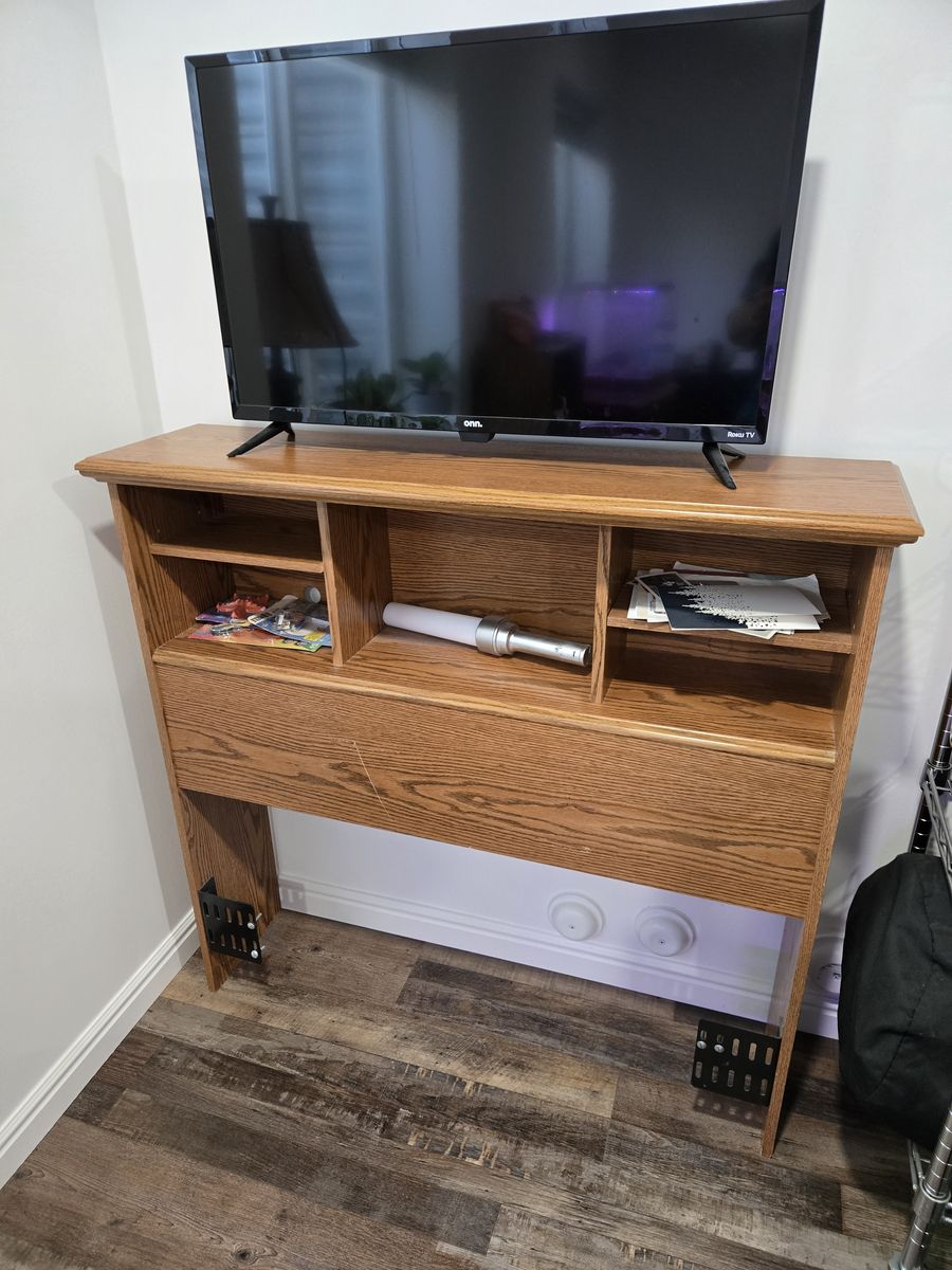 twin bed headboard shelf and TV