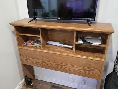 twin bed headboard shelf and TV