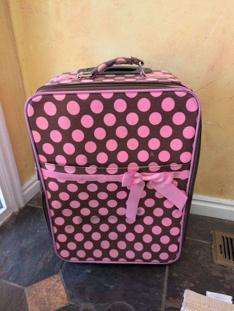 pink and brown polka dot suitcase