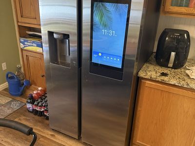 Samsung Family Hub Smart Refrigerator, Stainless Steel, Side-by-Side with Ice/Water Dispenser. Like-new condition.