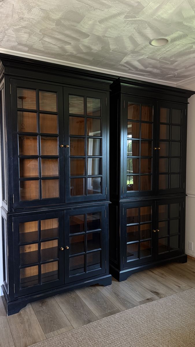 Set of two tall black cabinets