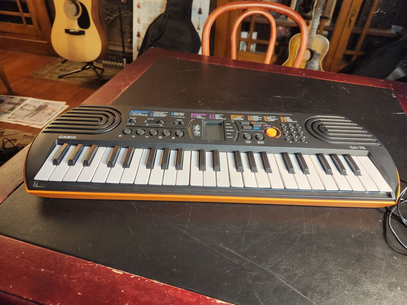 Casio SA-76 keyboard.  Cool Retro 70's styling.  Sweet coral orange color.  Works great.  44 keys. 100 tones 50 beats