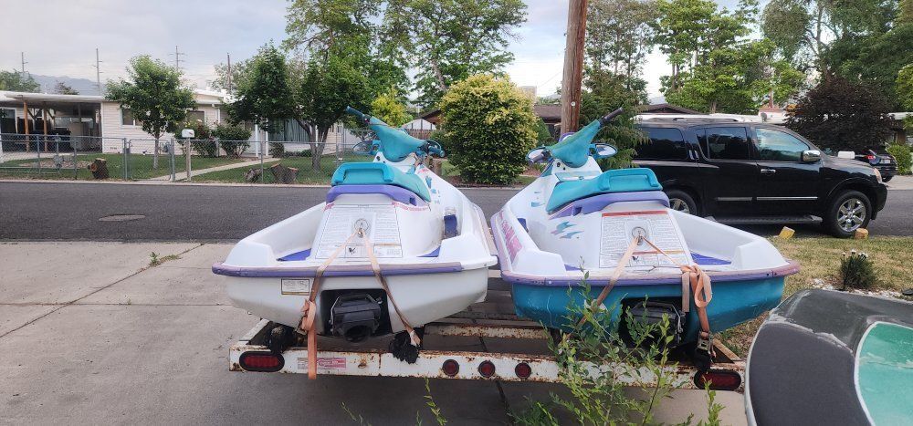 2 waverunners and trailer