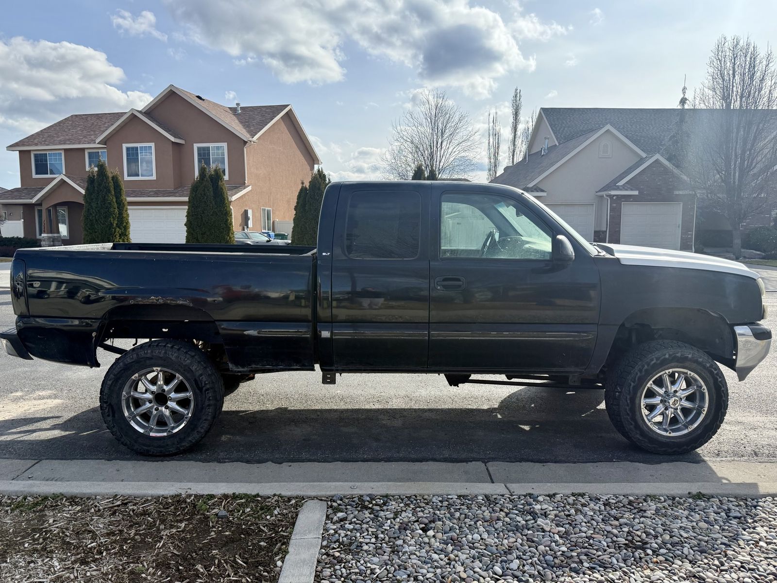 Chevy Silverado GMC Sierra Extended Cab Lifted Pickup Truck with Aftermarket Wheels