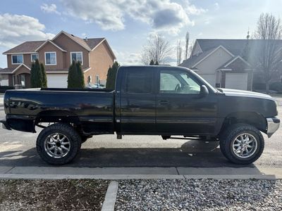 Chevy Silverado GMC Sierra Extended Cab Lifted Pickup Truck with Aftermarket Wheels