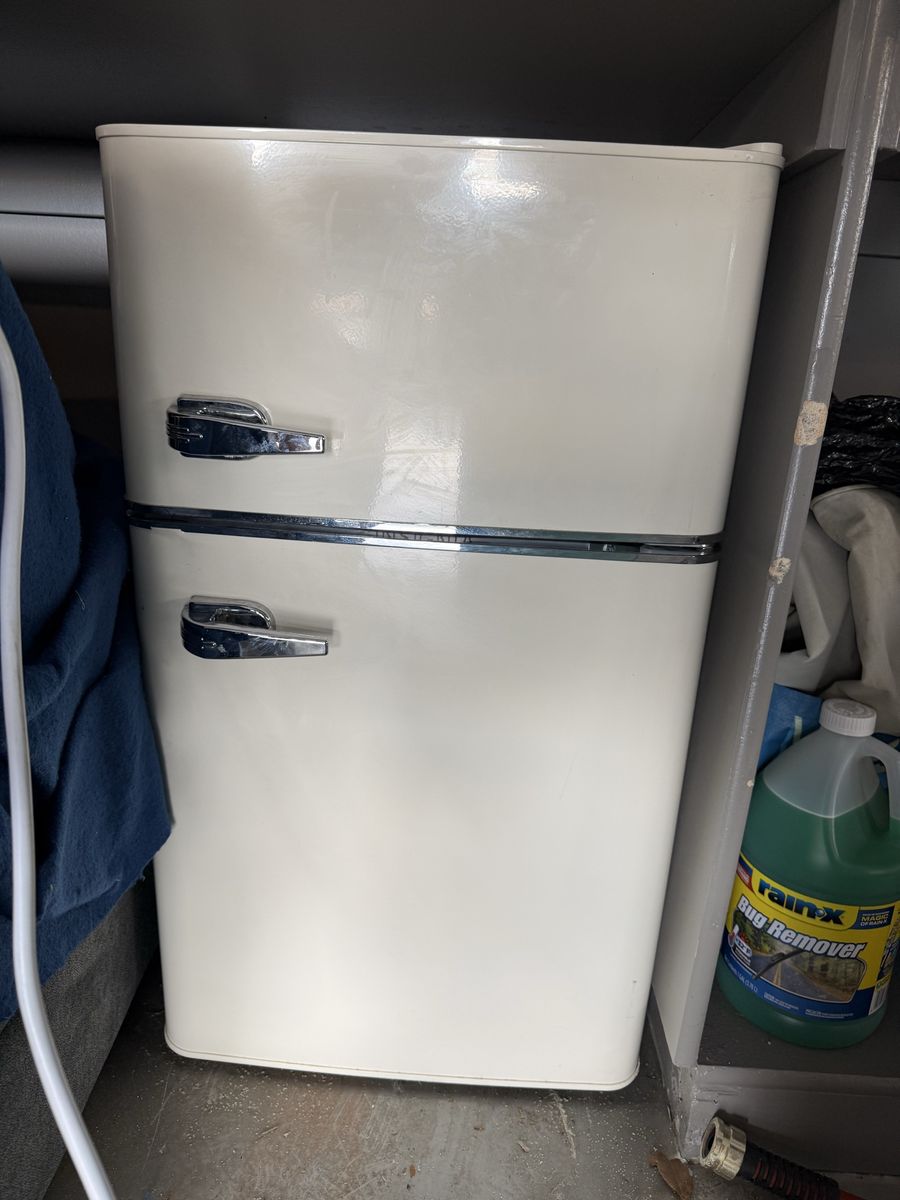 Compact ivory Top Freezer Refrigerator with Chrome Handles - Ideal for Small Spaces and Microwave (not pictured)