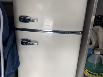 Compact ivory Top Freezer Refrigerator with Chrome Handles - Ideal for Small Spaces and Microwave (not pictured)
