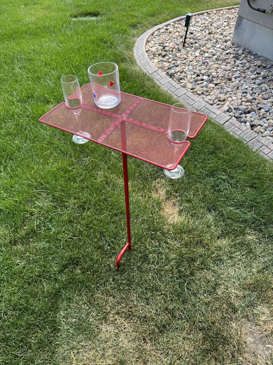Portable table and drink holders. Stick in the ground