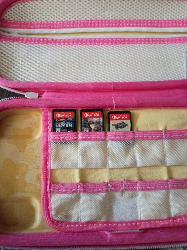 Nintendo Switch OLED Console with Kirby Carrying Case and 3 Games