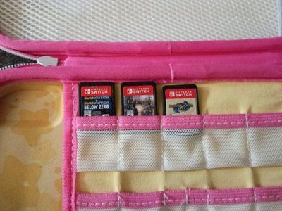 Nintendo Switch OLED Console with Kirby Carrying Case and 3 Games