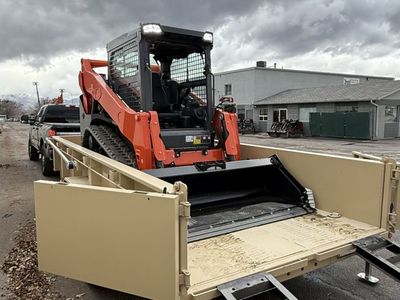 Kubota SVL75-3 Dump Trailer Combo for Rent - Large Track Skid Steer Combo
