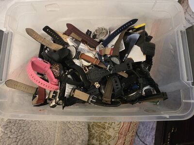 Box of watches bands and some batteries