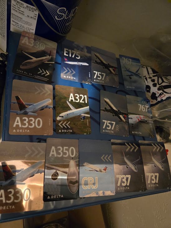 Pack of 13 brand new Delta trading cards 