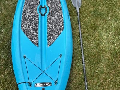 Blue lifetime paddleboard with fold up fins and adjustable paddle