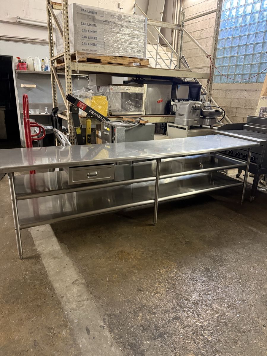 Used 120”X30” X36” H stainless steel table with 2 underneath shelves 14 gauge heavy duty 6 legs