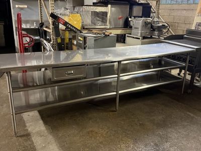 Used 120”X30” X36” H stainless steel table with 2 underneath shelves 14 gauge heavy duty 6 legs