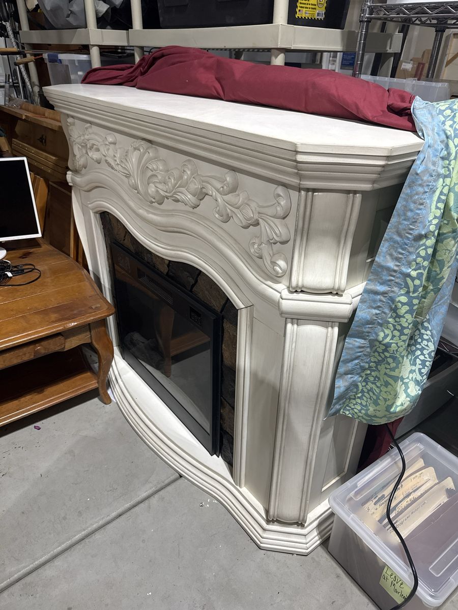 Decorative Electric Fireplace with Stone Accent and Ornate Mantel