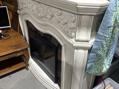 Decorative Electric Fireplace with Stone Accent and Ornate Mantel