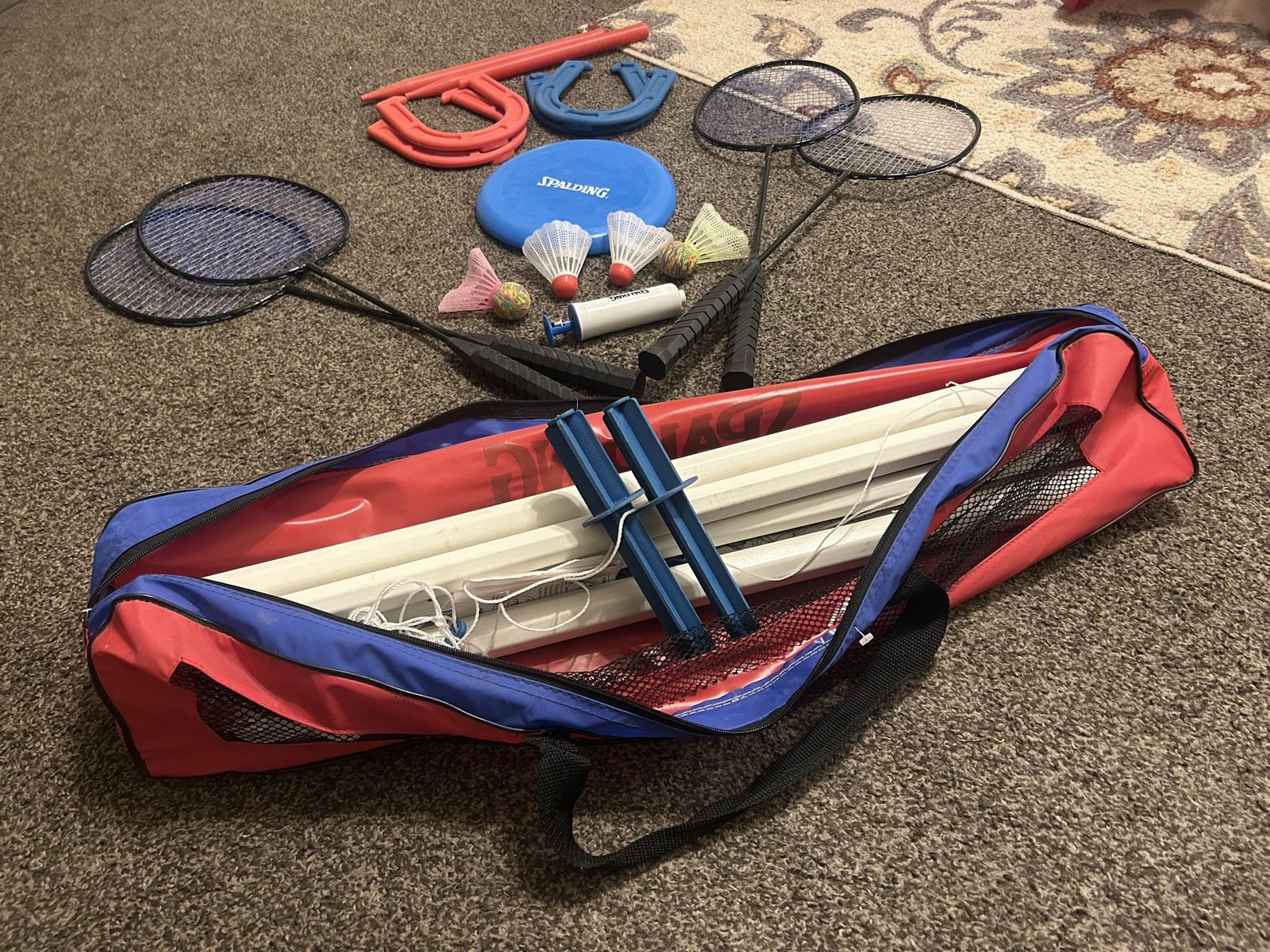 Spalding Outdoor Lawn Games set - 4 Badminton Rackets, 4 Shuttlecocks, 1 Net, 4 Horseshoes, 2 Stakes, 1 Ball Pump, & 1 Frisbe