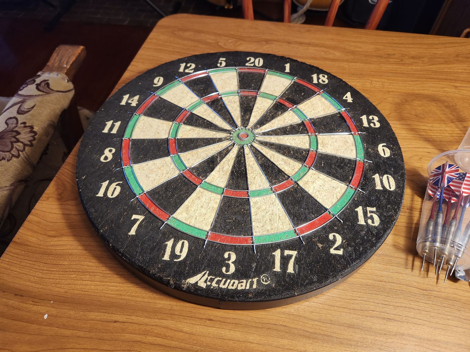 Cork dart board and high quality darts.  Perfect shape.