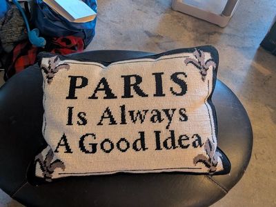 gold plated lamp and couch pillow