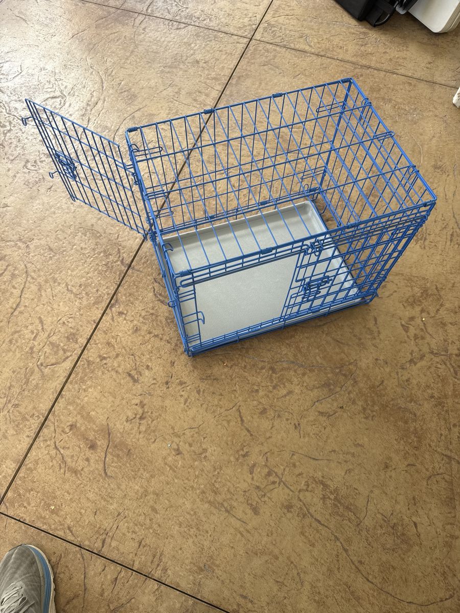 Pet Carrier Dog Crate - Blue Wire, Double Door, Collapsible, Kennel. 24 inches long x 17 inches wide x 20 inches tall.