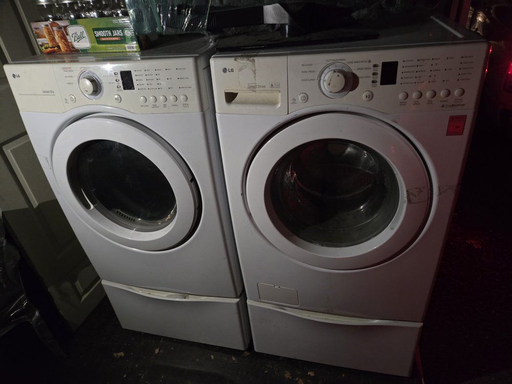LG TrueBalance Front Load Washer & Dryer with Storage Pedestals – $400